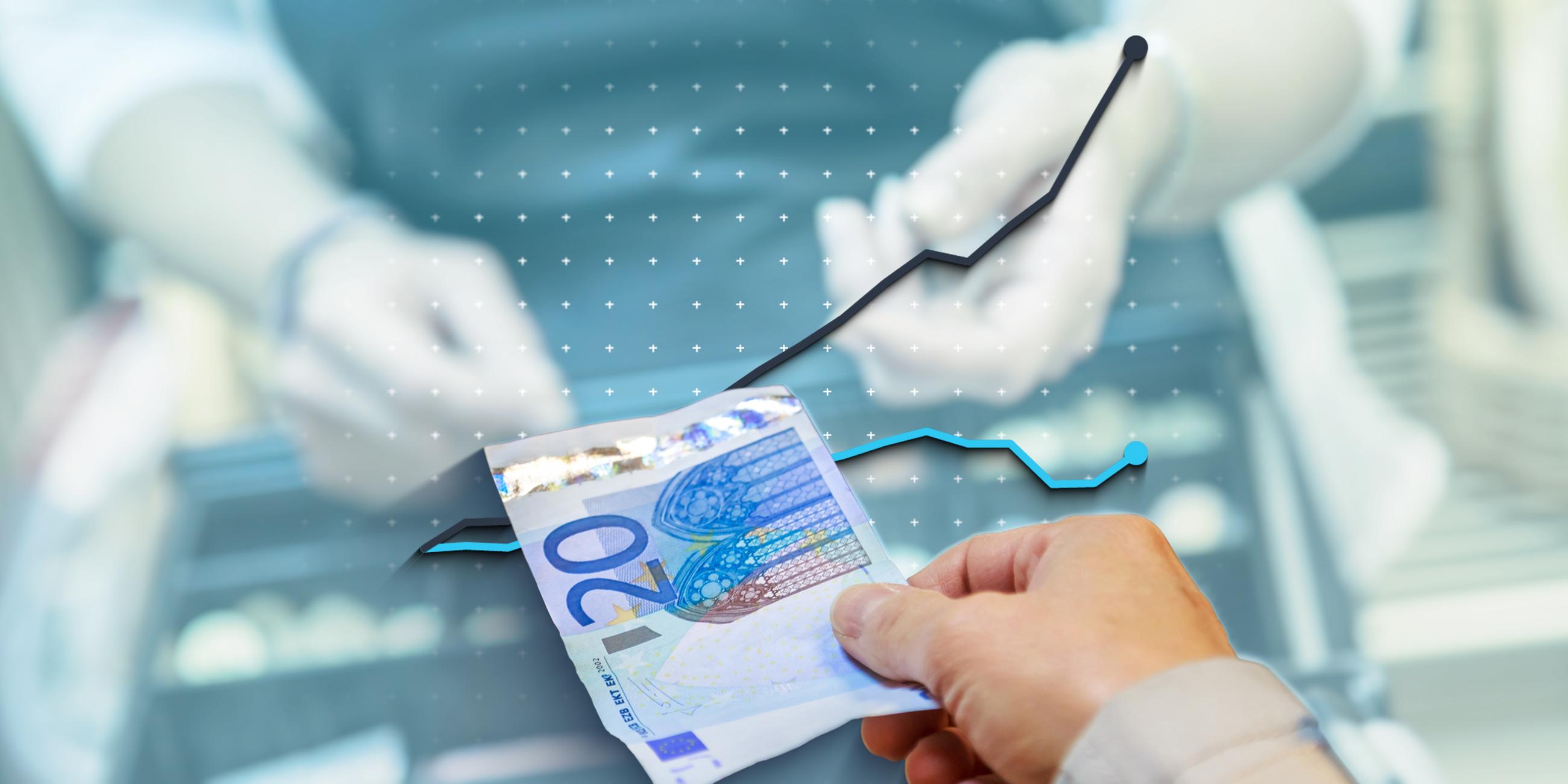 Das Bild zeigt einen 20-Euro-Schein sowie Kurven zur Nominal- und Reallohnentwicklung