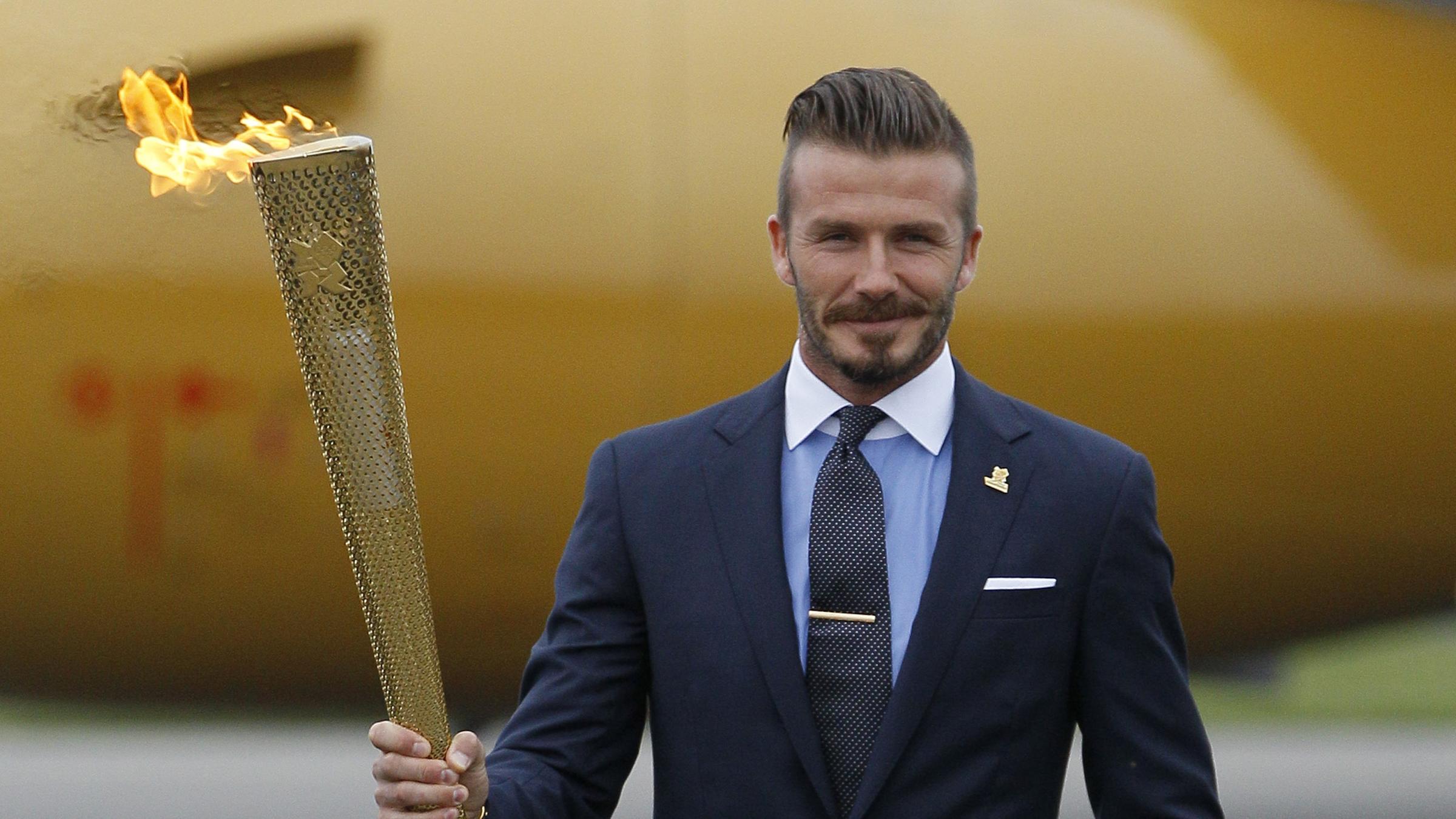 David Beckham mit olympischer Fackel im Jahr 2012.