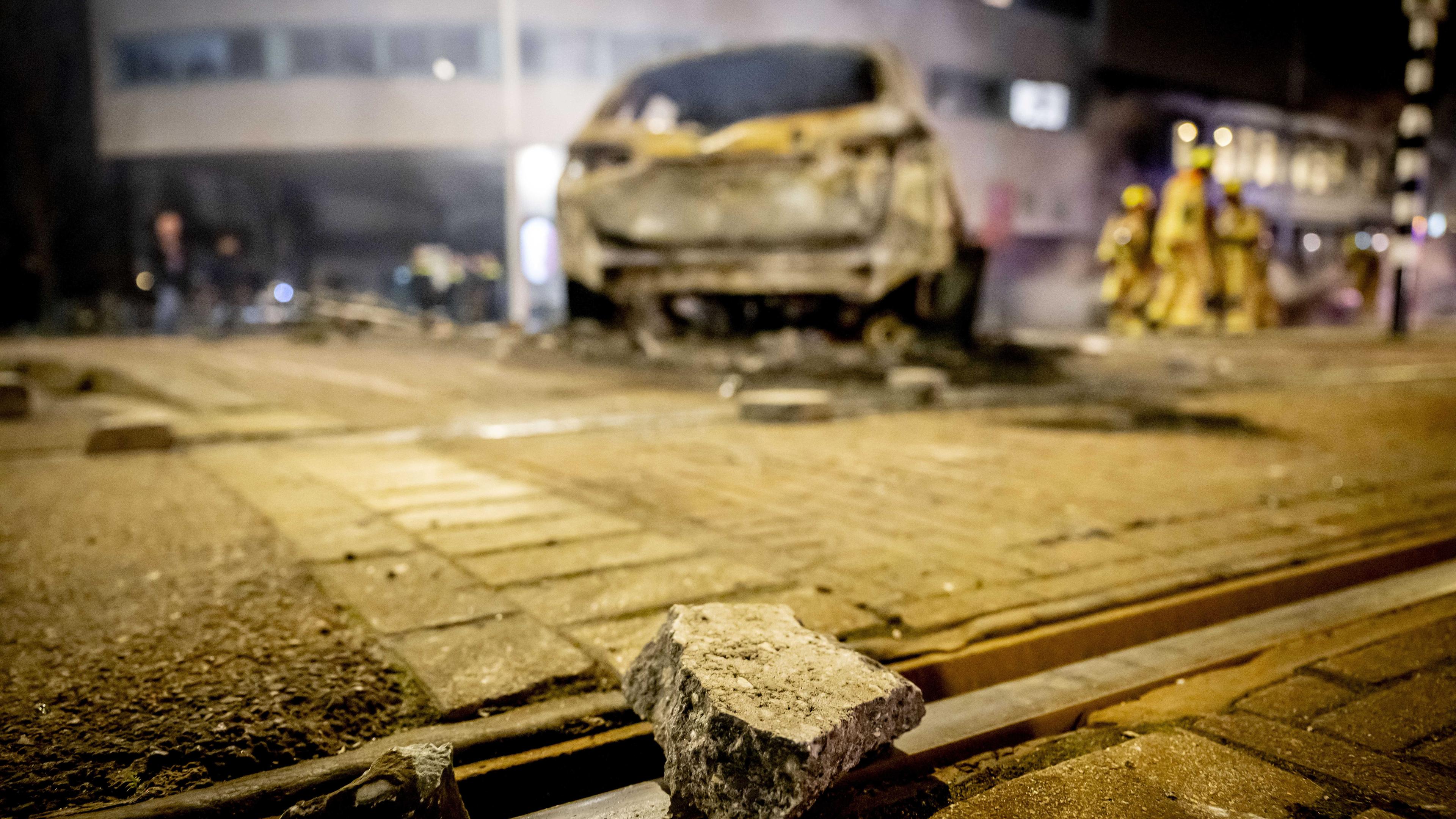 View of a burnt out police car after riots at the Opera hall center on the Fruitweg in The Hague, The Netherlands, 17 February 2024.
