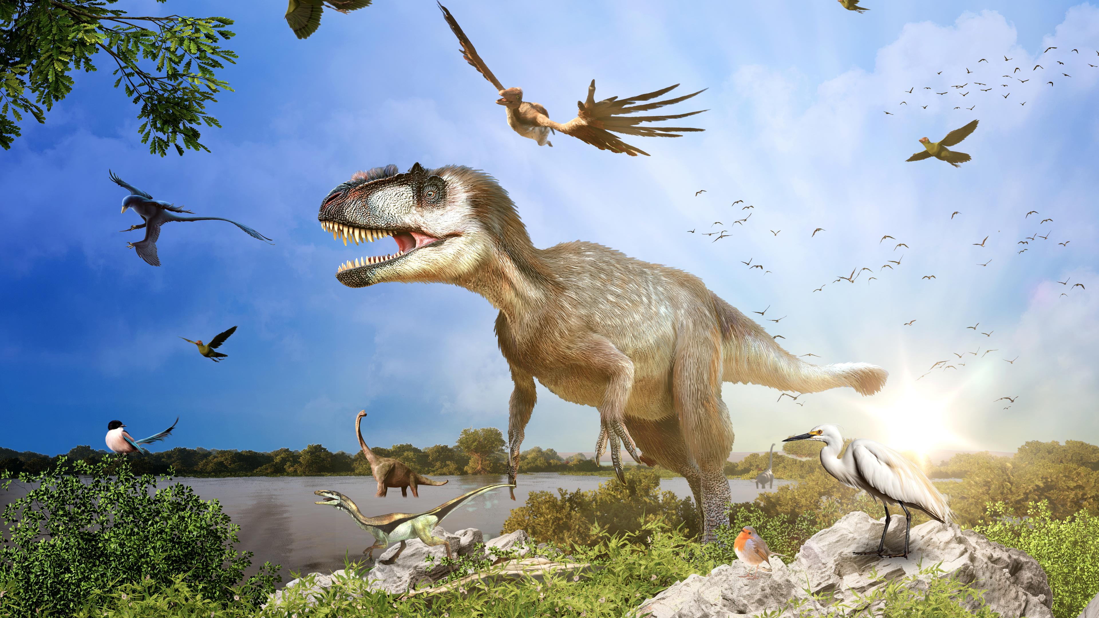 Computergeneriertes Bild von einem Yutyrannus und weiteren Dinosauriern, gemeinsam mit Vögeln am Himmel und auf dem Boden, im Hintergrund die Sonne.