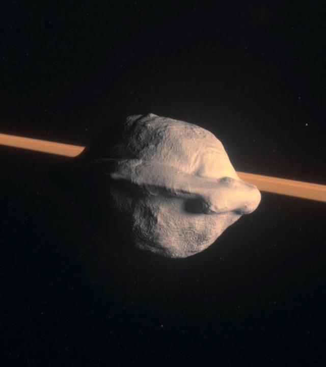 Computeranimiertes Bild eines Himmelskörpers in Form einer Walnuss, der im All schwebt, im Hintergrund ein heller orangefarbener Streifen.
