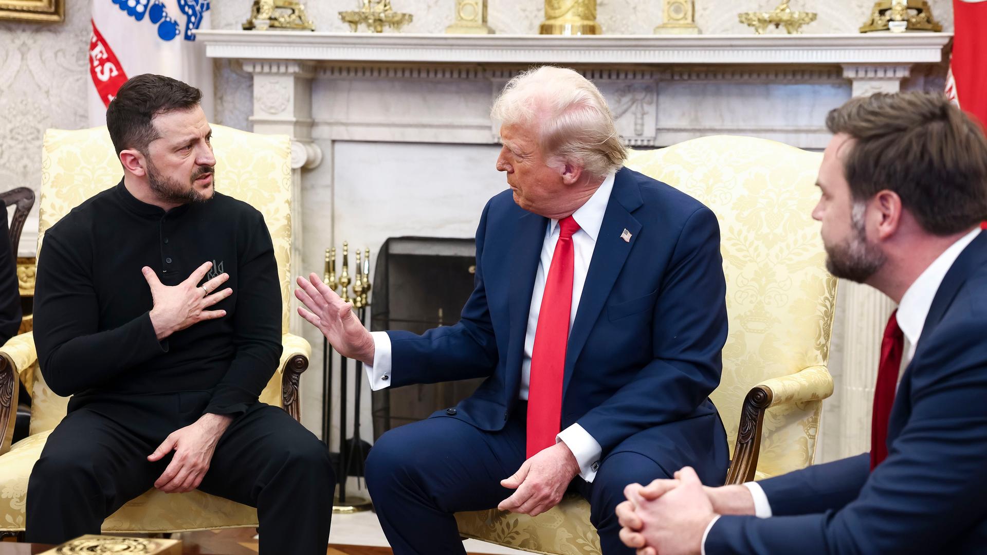 Ukrainian President Volodymyr Zelensky (L) talks with US President Donald Trump (C) and US Vice President JD Vance (R) in the Oval Office of the White House in Washington, DC.