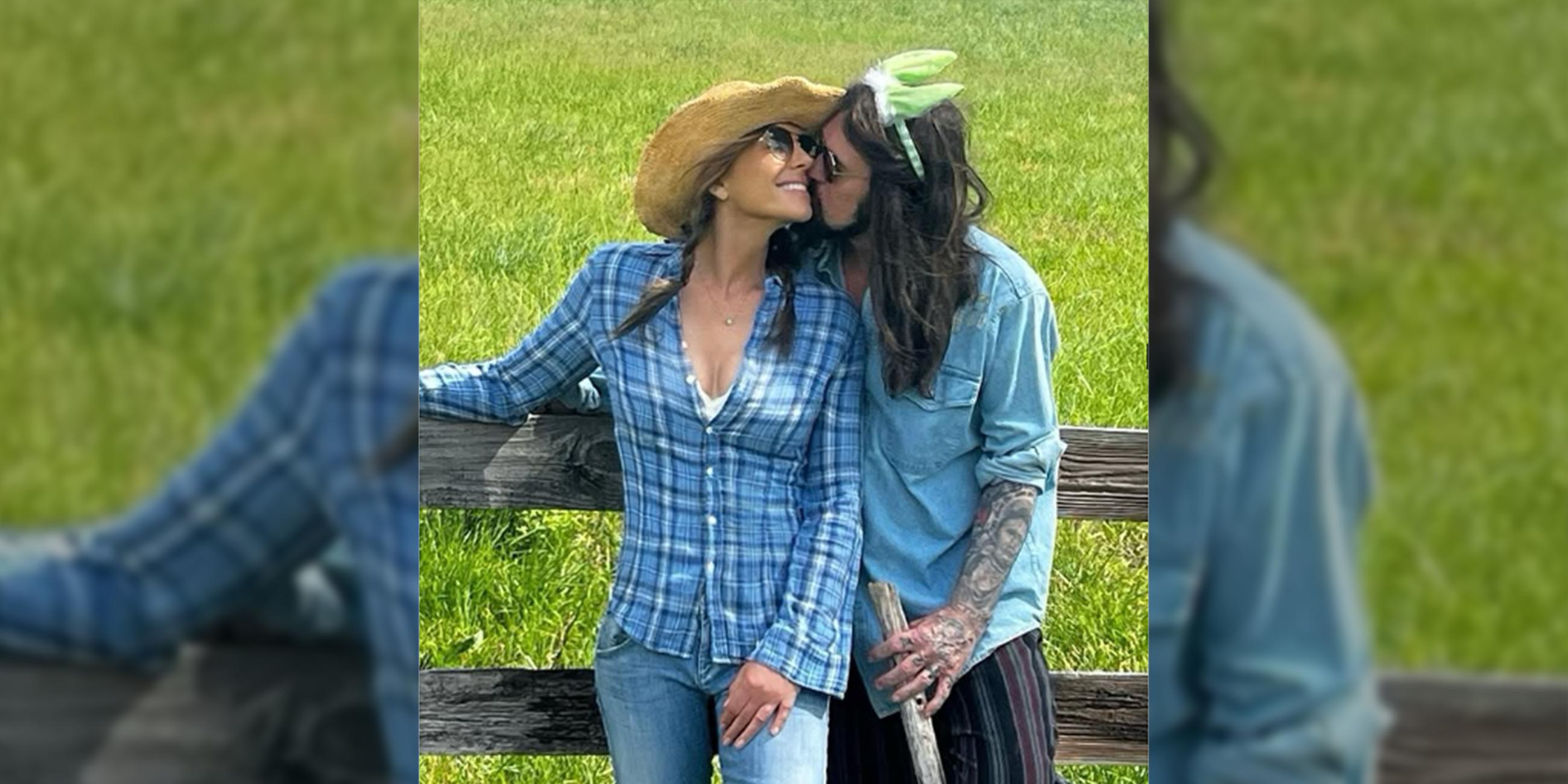 Elizabeth Hurley zeigt ihre neue Liebe: Der US-Country-Sänger Billy Ray Cyrus küsst die britische Schauspielerin.