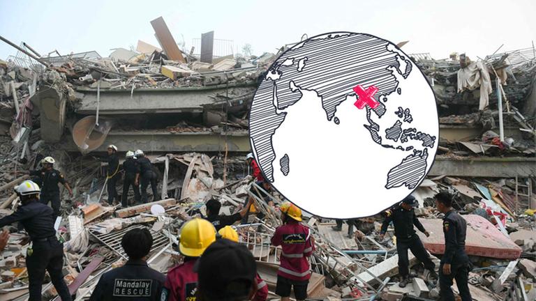 Helfer an einem eingestürzten Gebäude