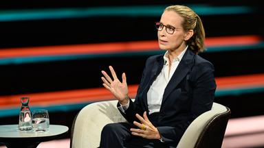 Frauke Brosius-Gersdorf sitzt bei Markus Lanz auf einem Stuhl. Sie gestikuliert mit beiden Händen während sie redet. Sie trägt einen Zopf.