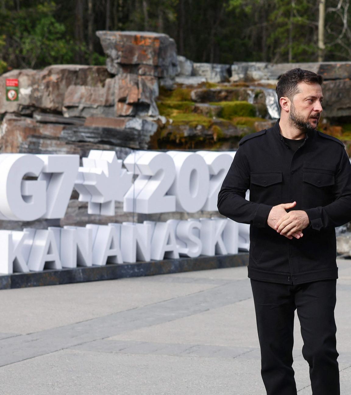 Canadian Prime Minister Mark Carney (R) welcomes Ukrainian President Volodymyr Zelenskyy during an arrival ceremony at the Group of Seven (G7) Summit at the Pomeroy Kananaskis Mountain Lodge in Kananaskis, Alberta, Canada on June 17, 2025. 