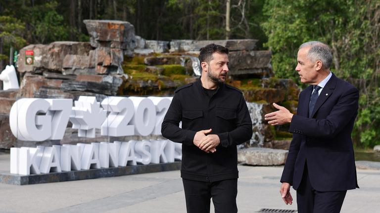 Canadian Prime Minister Mark Carney (R) welcomes Ukrainian President Volodymyr Zelenskyy during an arrival ceremony at the Group of Seven (G7) Summit at the Pomeroy Kananaskis Mountain Lodge in Kananaskis, Alberta, Canada on June 17, 2025. 
