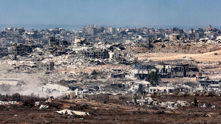 Destroying buildings in the Gaza Strip are pictured from a position along Israel's southern border with the besieged Palestinian territory on August 5, 2025.