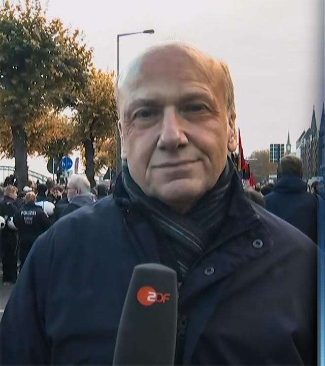 ZDF-Reporter Carsten Behrendt und Peter Böhm zugeschaltet ins Studio aus Berlin und Köln
