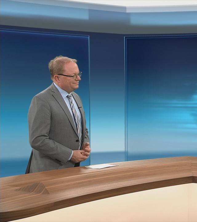 Moderatorin im Expertengespräch mit Jürgen Erbacher