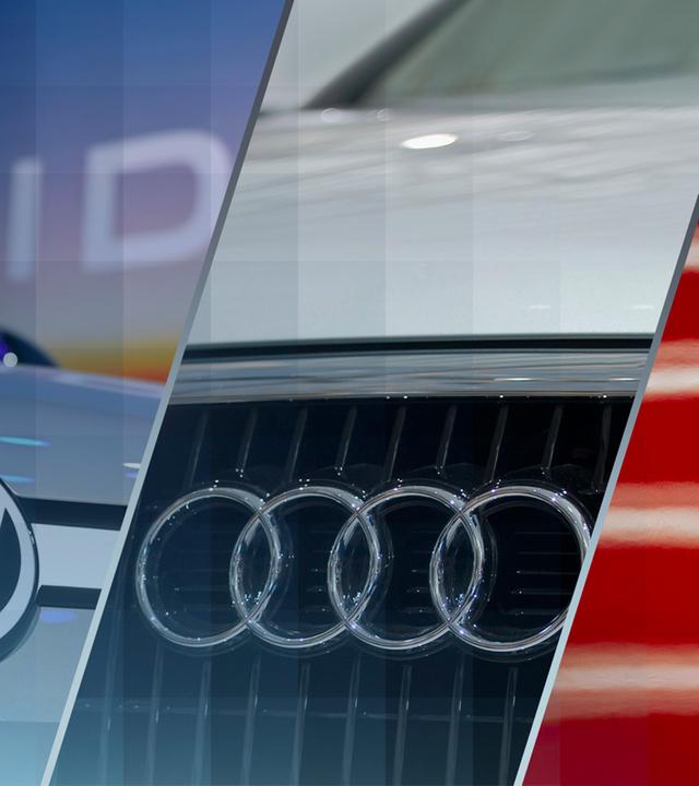 Die Logos der Marken VW, Porsche und Audi auf den jeweilligen Autos.
