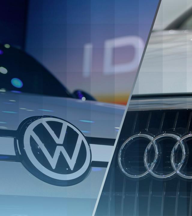 Die Logos der Marken VW, Porsche und Audi auf den jeweilligen Autos.
