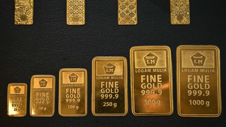 Gold wafers are displayed.