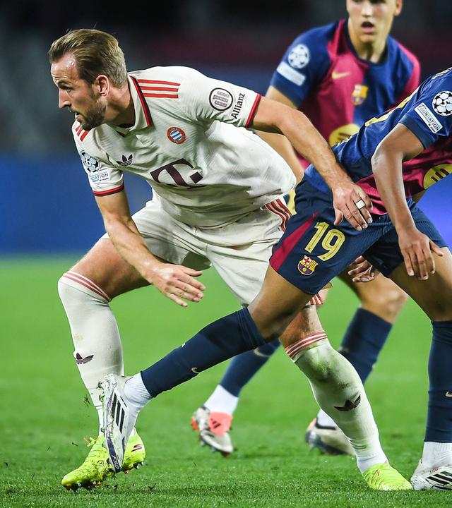 Harry Kane und Lamine Yamal im Kampf um den Ball