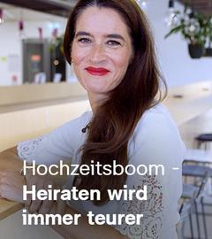 Sina Mainitz sitzt an einem Tresen; auf dem Bild steht der Text "Hochzeitsboom - Heiraten wird immer teurer"