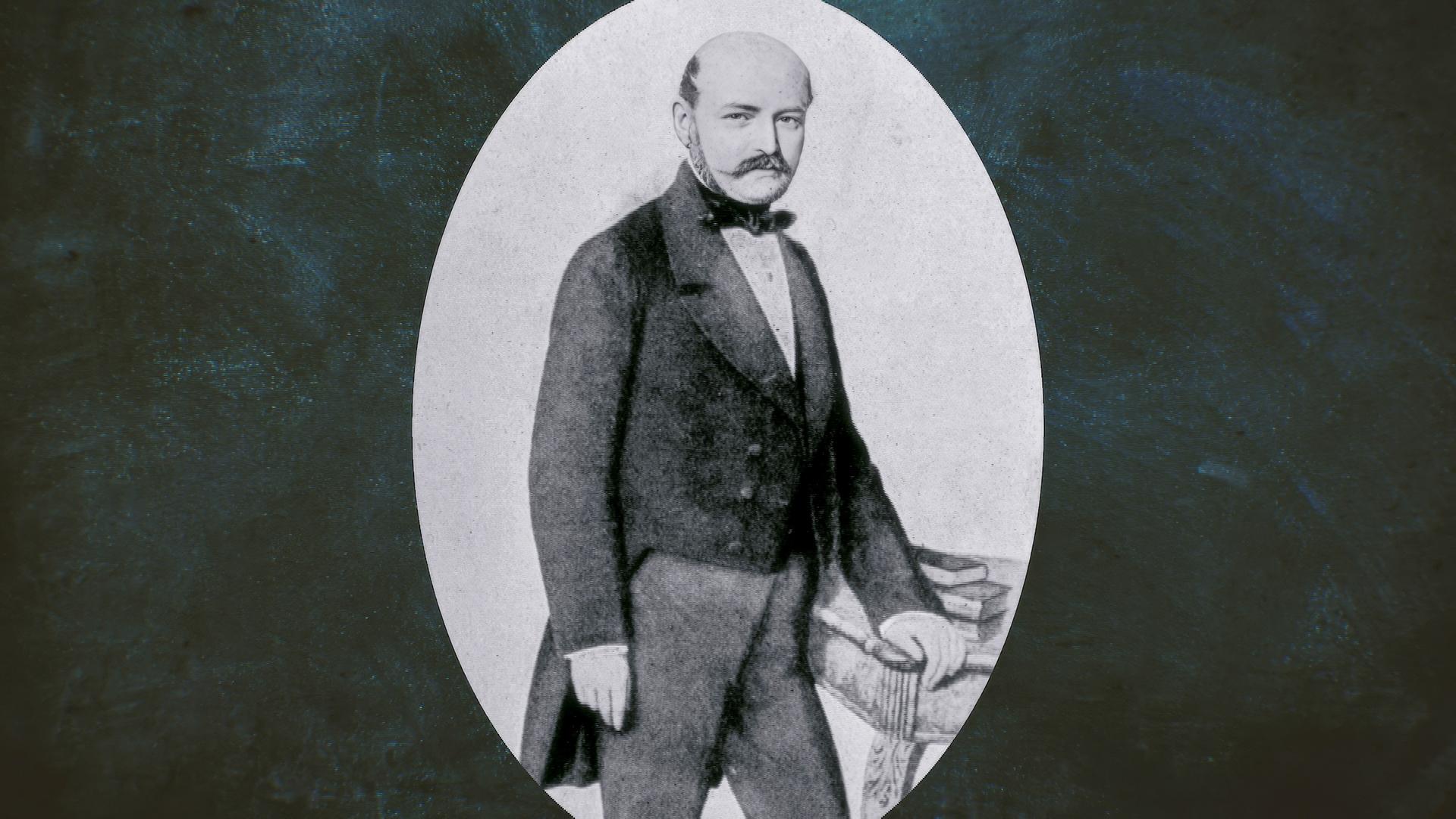 Ein Bild von Ignaz Semmelweis ist in einer Vignette eingerahmt.
