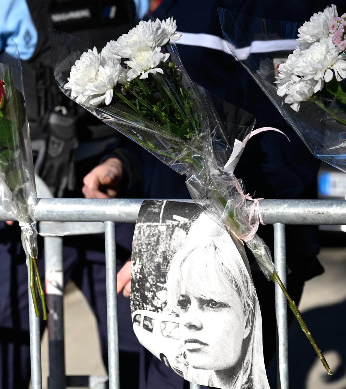 Posters showing actor Brigitte Bardot hang at a security barrier near her home in Saint-Tropez