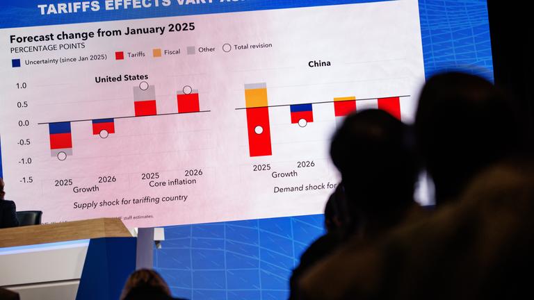 A chart showing the International Monetary Funds predicted effects of tariffs on various countries is shown during a press briefing on the World Economic Outlook on April 22, 2025 in Washington, D.C.