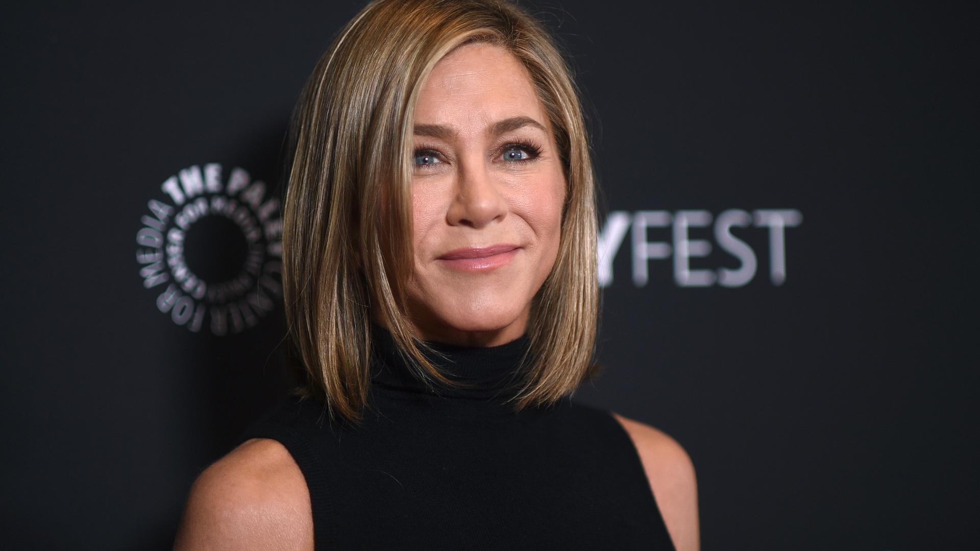 Jennifer Aniston arrives at a screening of "The Morning Show" during PaleyFest, April 12, 2024, at the Dolby Theatre in Los Angeles.