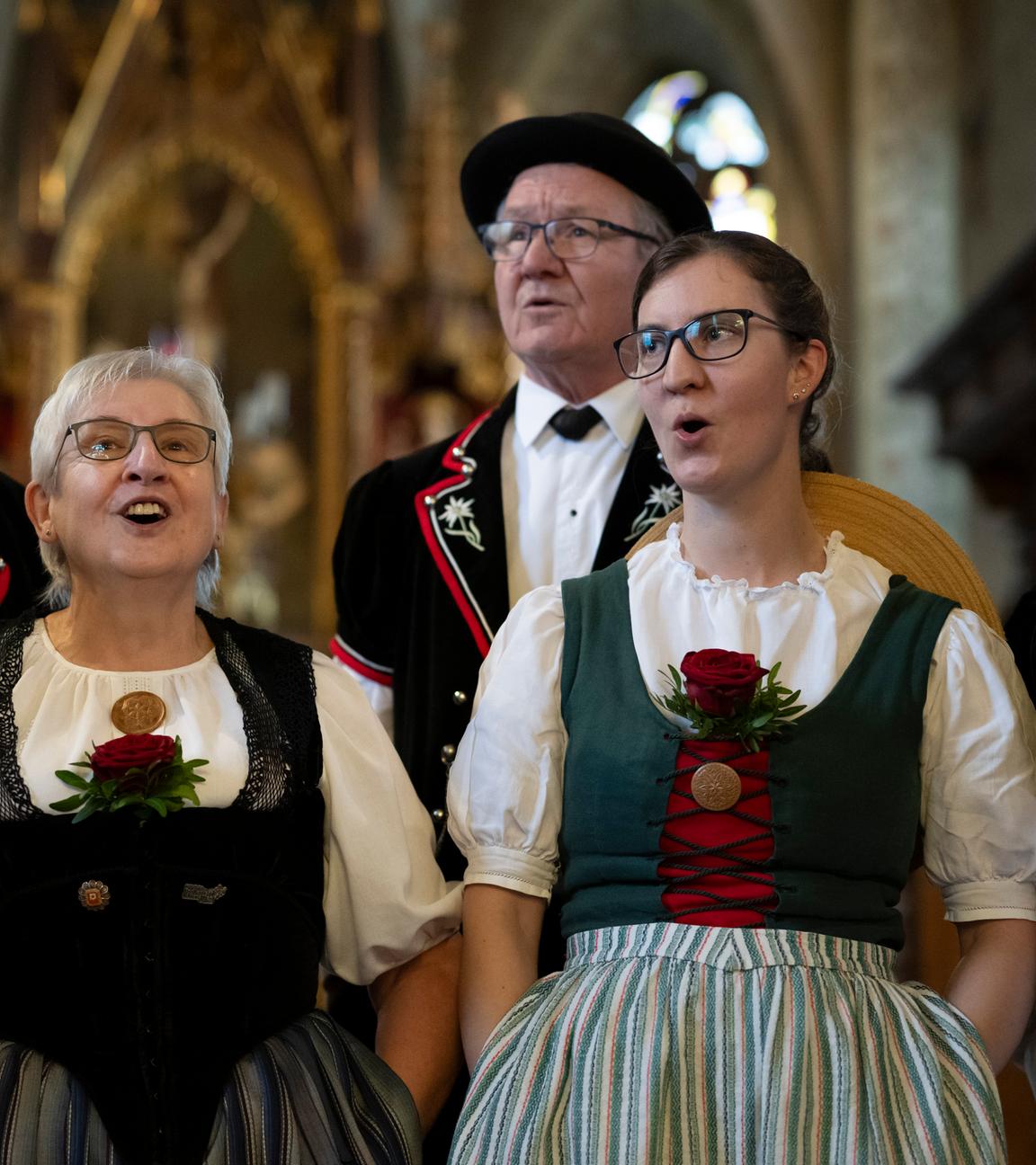 Members of the yodeling club named Jodelclub Stadtjodler Heimelig Frauenfeld perform in a church in Lommis.
