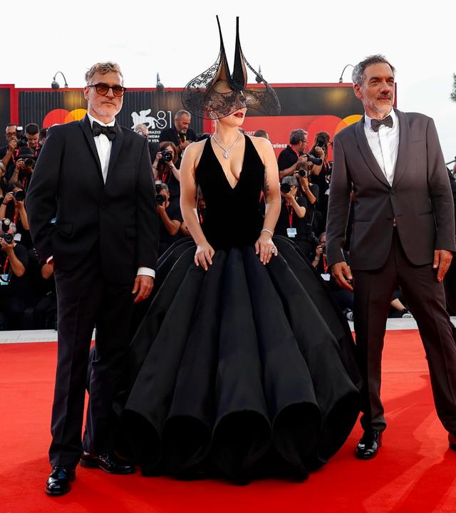 US actor Joaquin Phoenix, US singer and actor Lady Gaga and US director Todd Phillips arrive for the premiere of 'Joker: Folie a Deux' at the 81st annual Venice International Film Festival, in Venice, Italy, 04 September 2024. The movie is presented in the official competition 'Venezia 81' at the festival running from 28 August to 07 September 2024.