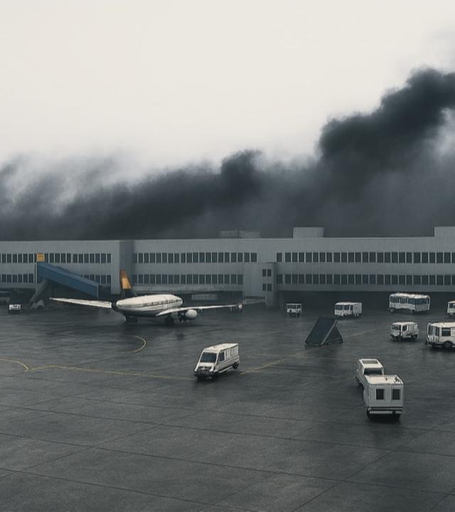Düsseldorfer Flughafen 1996 mit schwarzem Rauch im Hintergrund