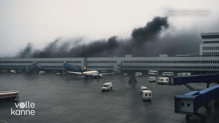 Düsseldorfer Flughafen 1996 mit schwarzem Rauch im Hintergrund