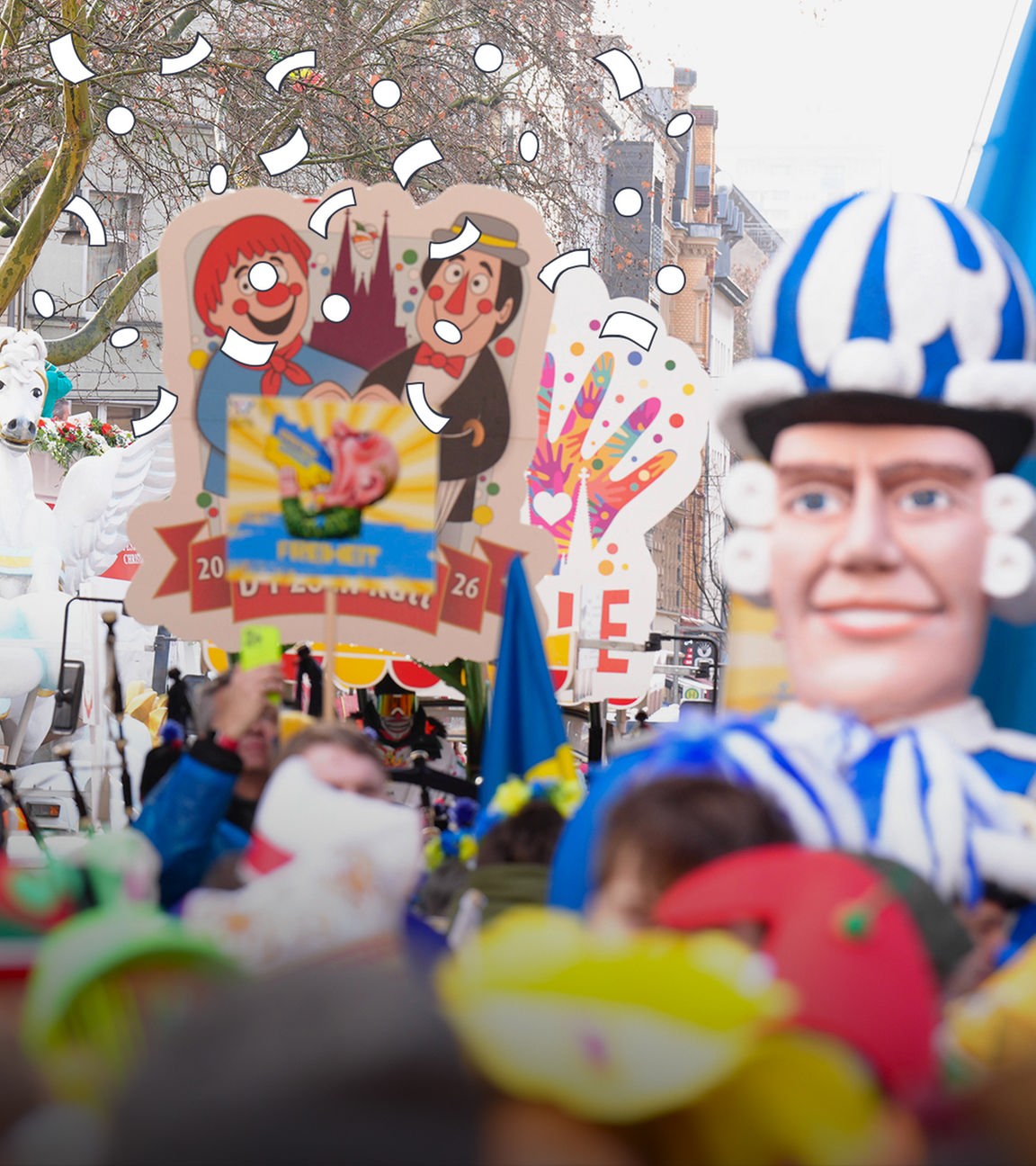 Herrscht heute in vielen Städten in Deutschland, denn es ist Rosenmontag! Auf den Umzügen gibt es Wagen, die bunt dekoriert sind, und viele Menschen in Kostümen.