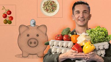 Erik Meyer hält Obst und Gemüse in der Hand 