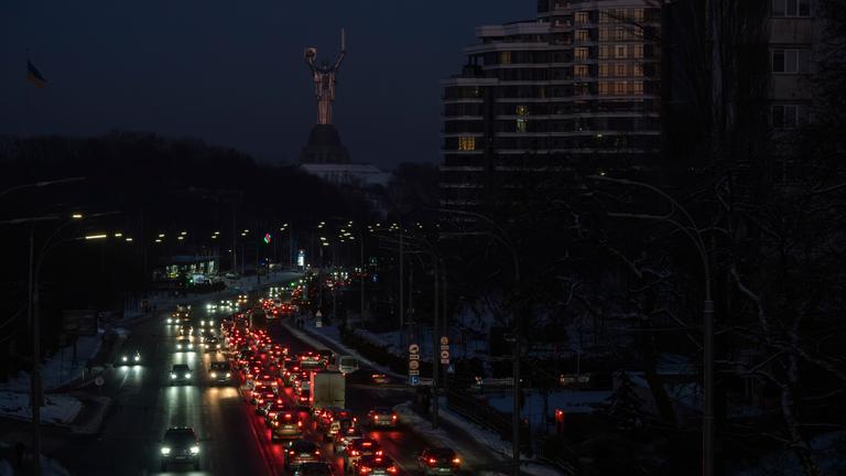 Cars drive along a road during a power outage in downtown Kyiv, Ukraine, 20 January 2026
