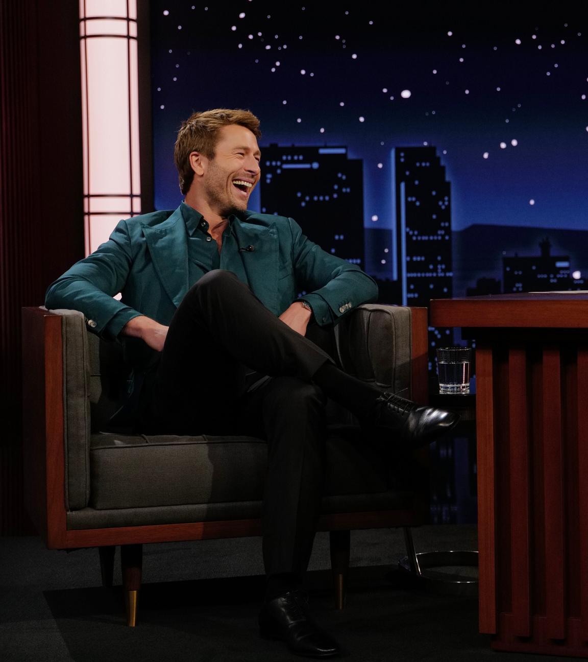 This image released by Disney shows guest Glen Powell, left, and host Jimmy Kimmel on "Jimmy Kimmel Live!" in Los Angeles