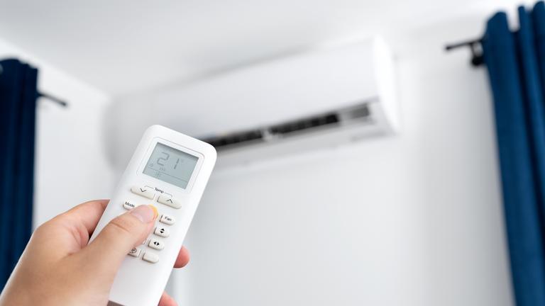 Adjusting temperature of air conditioner by remote. Air conditioning system