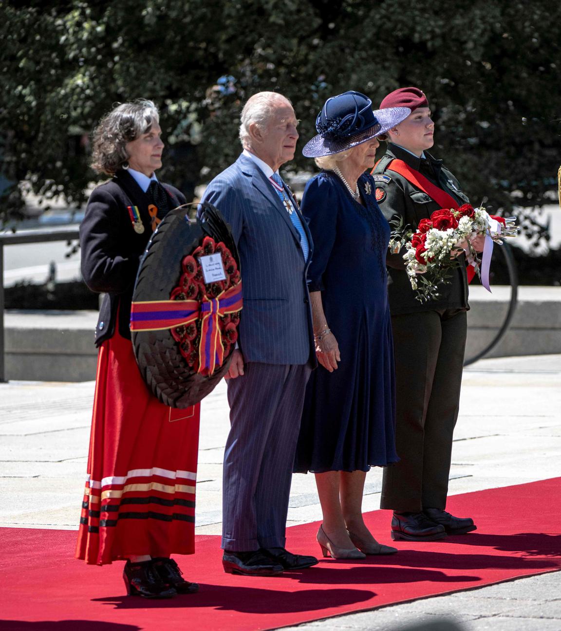 Britain's King Charles III and Queen Camilla arrive to lay a wreath at The Tomb of the Unknown Soldier at the National War Memorial in Ottawa, Canada on May 27, 2025.