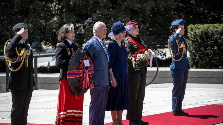 Britain's King Charles III and Queen Camilla arrive to lay a wreath at The Tomb of the Unknown Soldier at the National War Memorial in Ottawa, Canada on May 27, 2025.