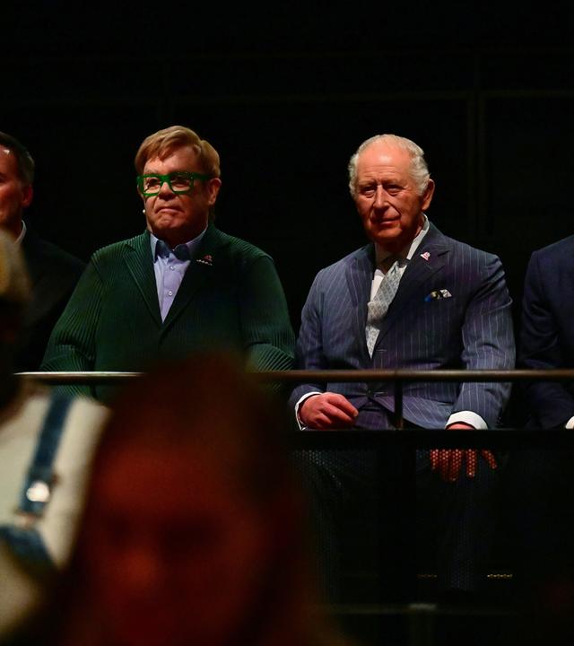 Britain's King Charles listens along side British singer-songwriter Elton John during a music workshop for young people, at Battersea Power Station in south west London, Wednesday.