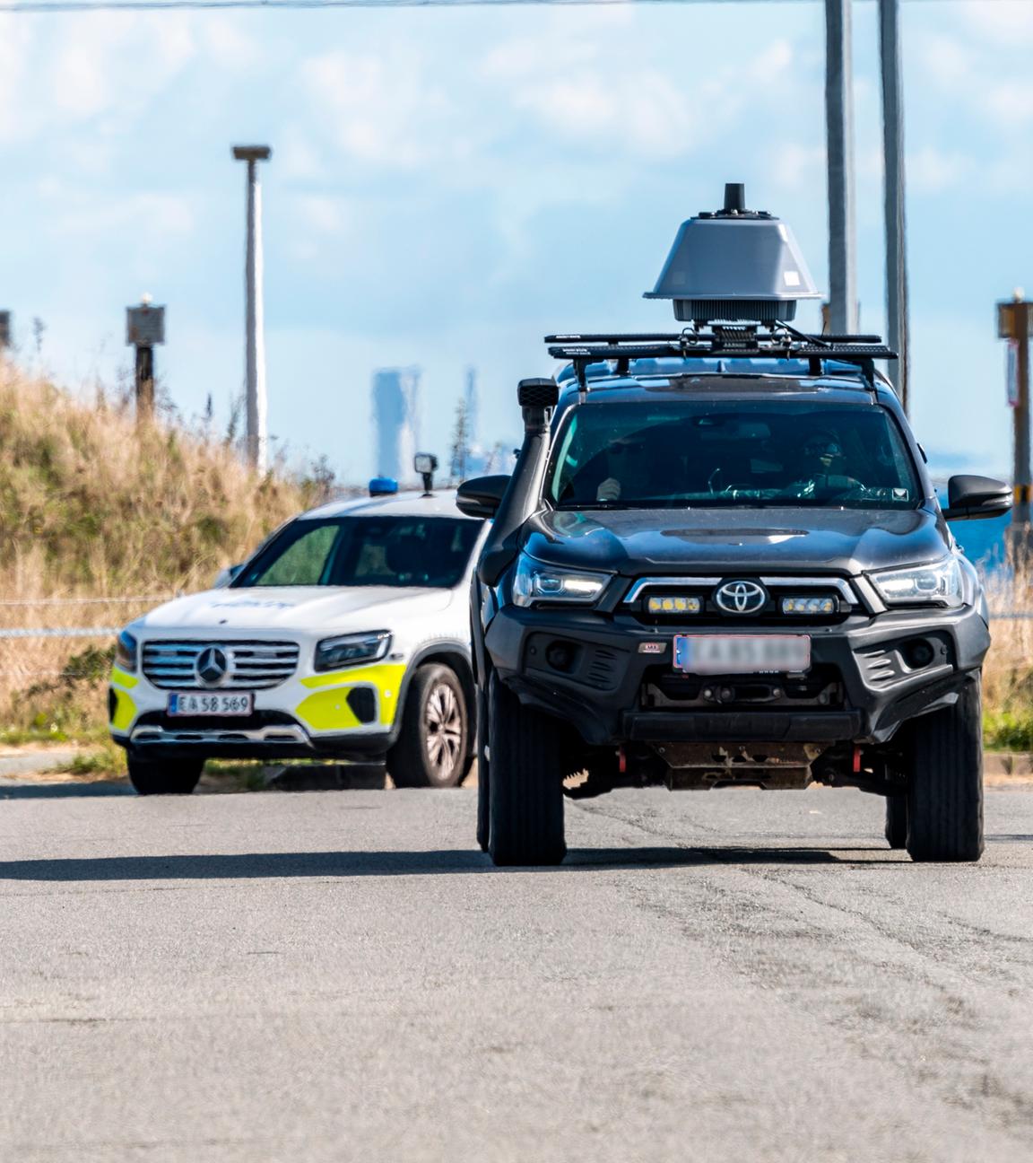 The police and members of the Danish Security and Intelligence Service (PET) inspect an area at DSB on Kystvejen near Copenhagen Airport in Copenhagen