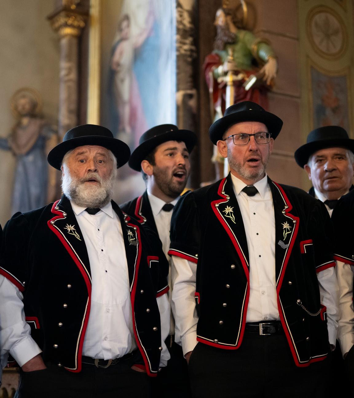 Members of the yodeling club named Jodelclub Stadtjodler Heimelig Frauenfeld perform in a church