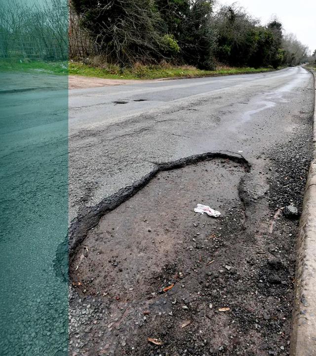 Kaputte Straße mit Schlaglöchern