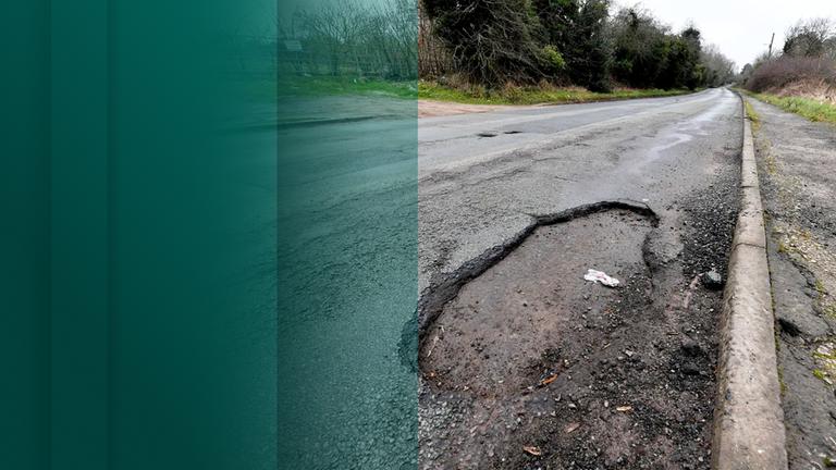 Kaputte Straße mit Schlaglöchern