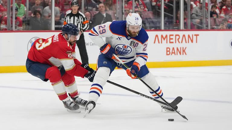 Florida PanthersSam Reinhart (13) and Edmonton Oilers center Leon Draisaitl 