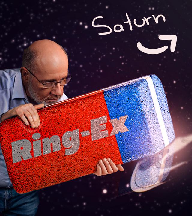 Harald Lesch mit einem riesigen Radiergummi neben Saturnringen