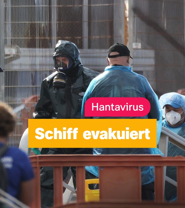 Evakuierung des Hantavirus-Kreuzfahrtschiffes - Menschen mit Schutzanzügen und Masken