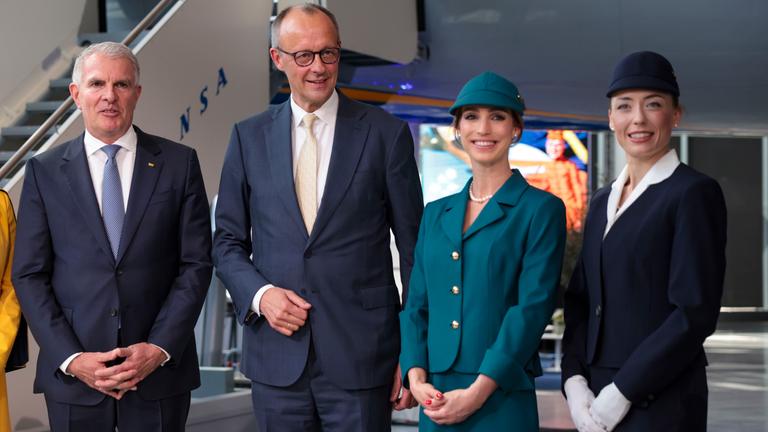 ermany's Chancellor Friedrich Merz (2-L) and Lufthansa CEO Carsten Spohr (L) attend a ceremony marking Lufthansa's 100th anniversary in Frankfurt am Main, Germany, 15 April 2026.