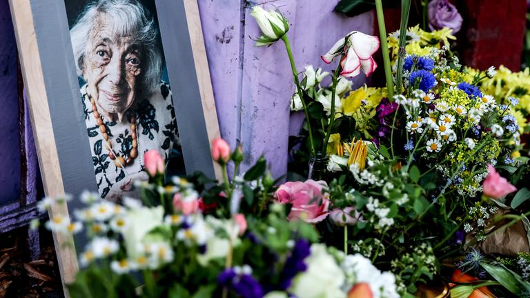 Flowers and candles are placed in front of the house where the late Margot Friedlaender lived in the Kreuzberg district of Berlin, Germany, 11 May 2025.
