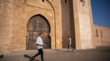 People walk next to the walls of the old Medina on Rabat, Morocco, Wednesday, Sept. 23, 2026. (AP Photo/Mosa'ab Elshamy)