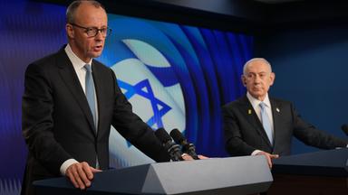 Israeli Prime Minister Benjamin Netanyahu (R) and German Chancellor Friedrich Merz speak to the media during a joint press conference in Jerusalem
