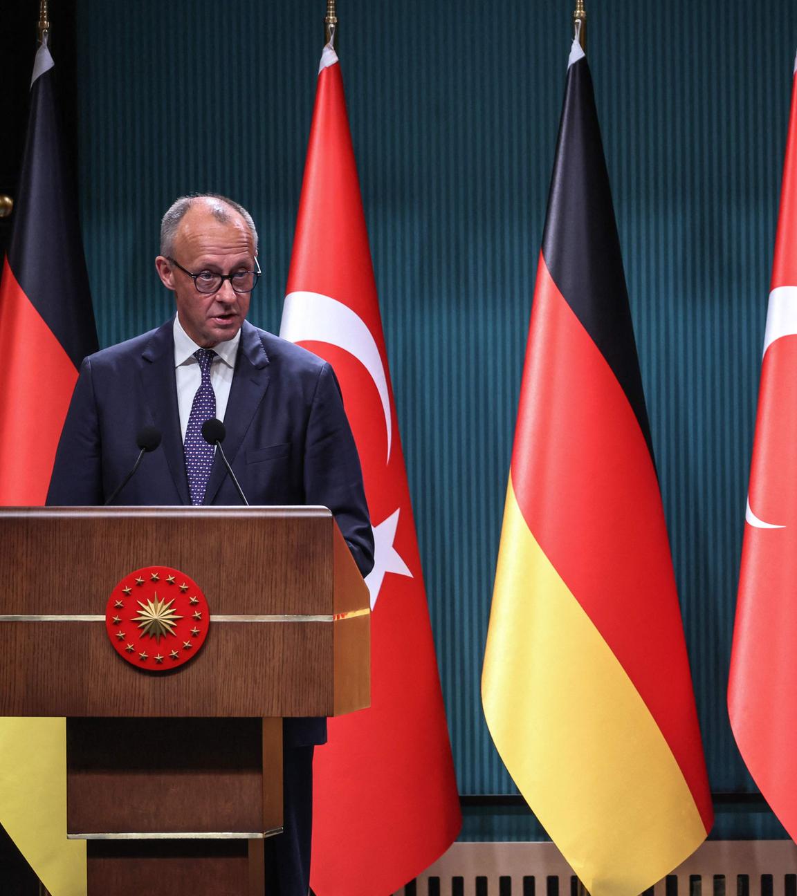 Turkey's President Recep Tayyip Erdogan (R) and German Chancellor Friedrich Merz (L) attend a joint press conference at the Presidential Complex in Ankara.