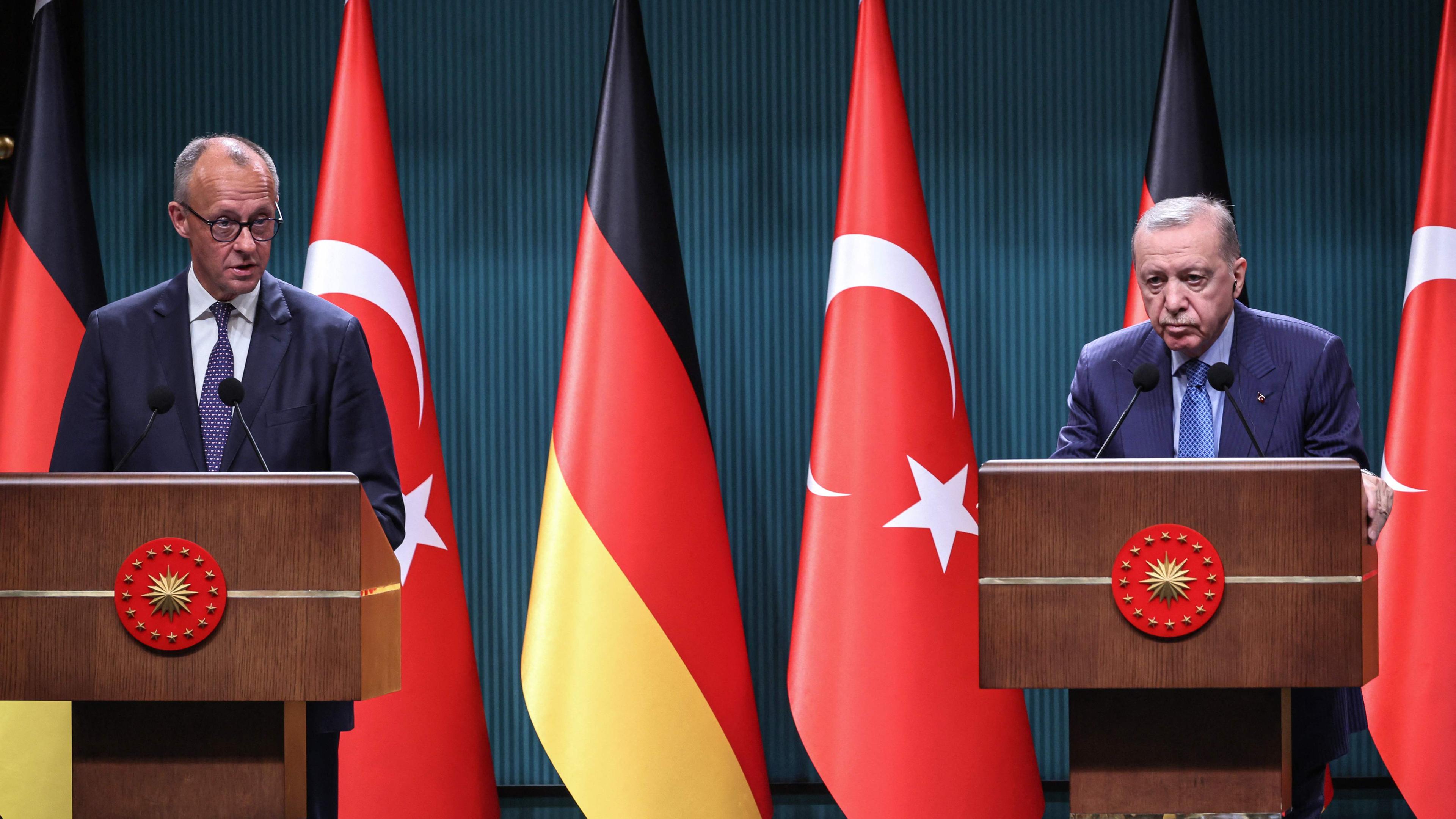 Turkey's President Recep Tayyip Erdogan (R) and German Chancellor Friedrich Merz (L) attend a joint press conference at the Presidential Complex in Ankara.