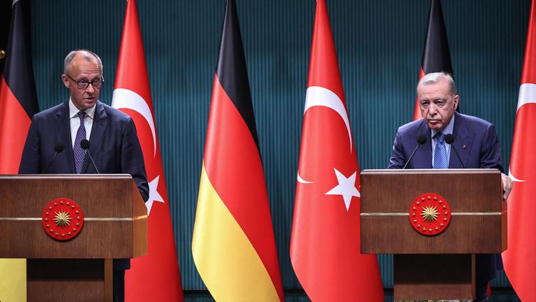 Turkey's President Recep Tayyip Erdogan (R) and German Chancellor Friedrich Merz (L) attend a joint press conference at the Presidential Complex in Ankara.