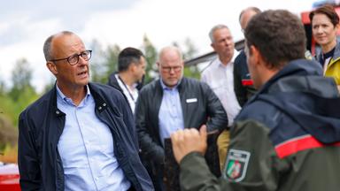 German Chancellor Friedrich Merz visits Huertgenwald following wildfires near Dueren, Germany, 22 August 2026. The wildfire in Huertgenwald, one of the largest forest fires in North Rhine-Westphalias history, burned around 300 hectares of forest before being brought under control on August 20.